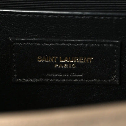 Black leather interior label reading SAINT LAURENT PARIS