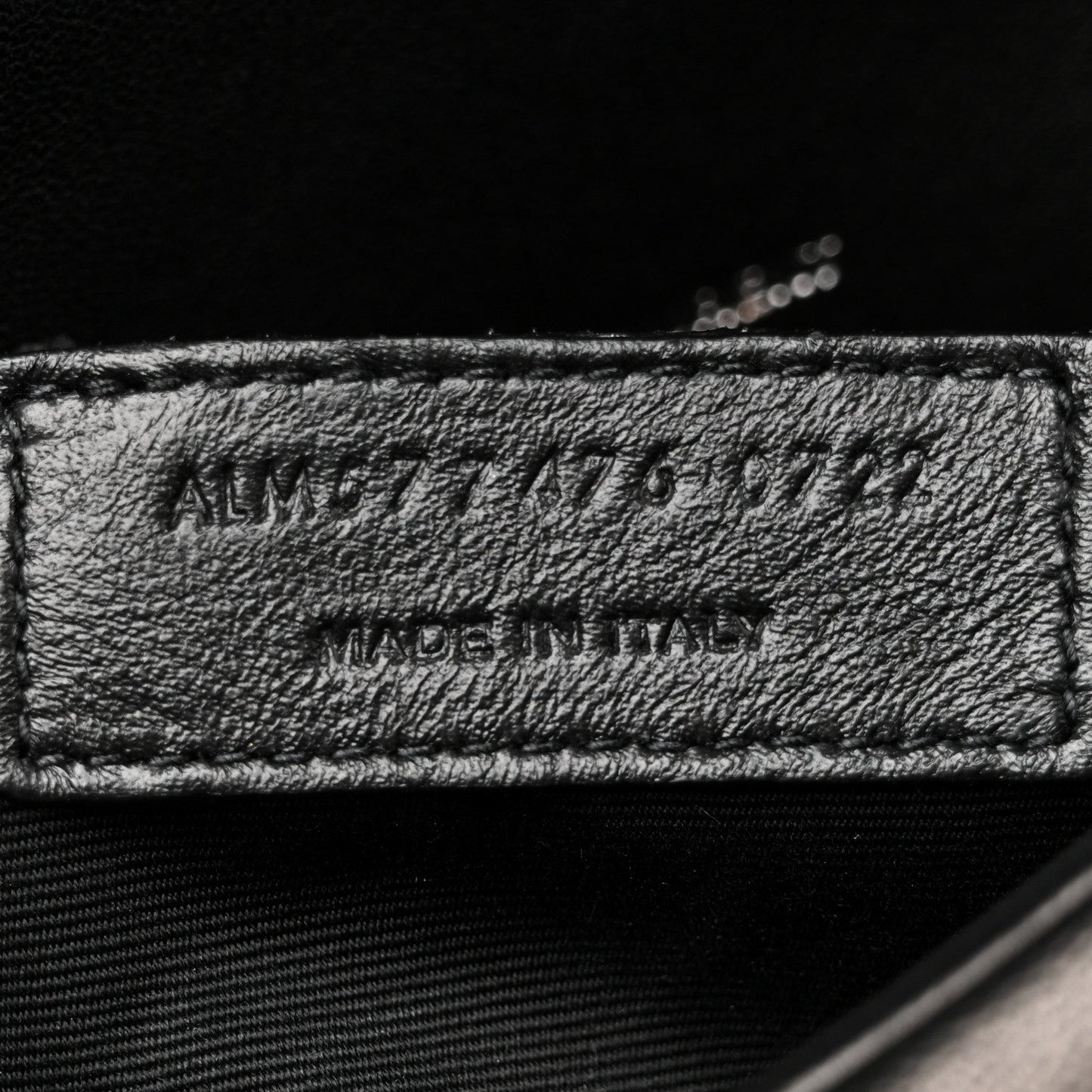 Made in Italy leather label on black satchel interior lining
