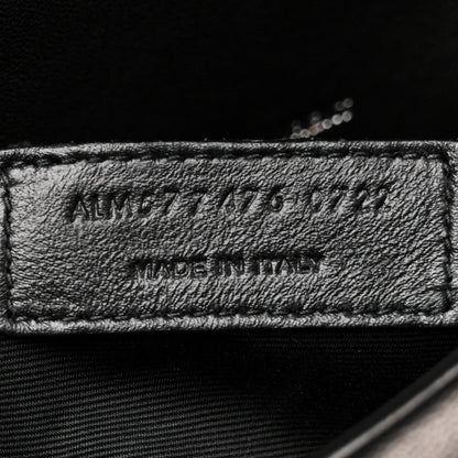 Made in Italy leather label on black satchel interior lining