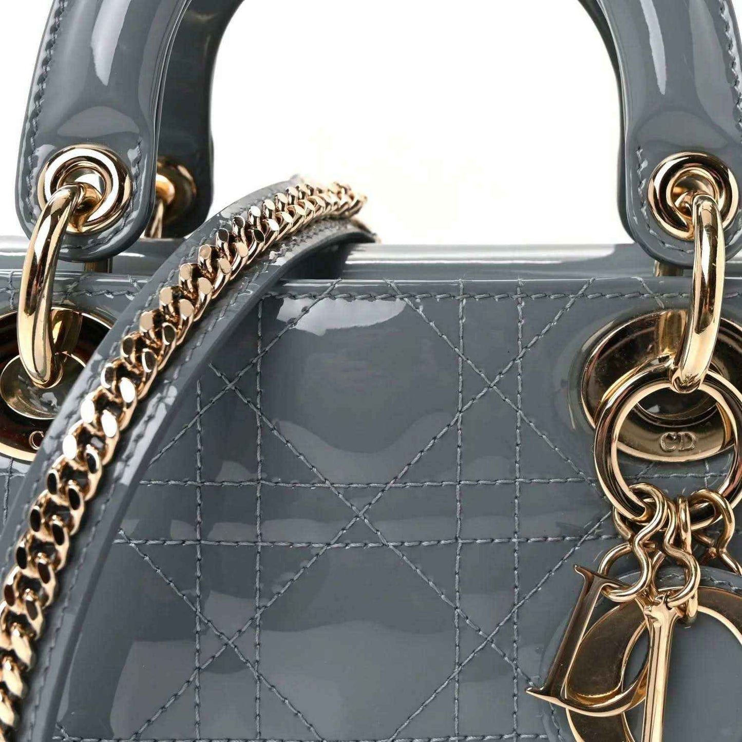 Light blue patent mini Lady Dior bag front detail with chain link strap and gold rings