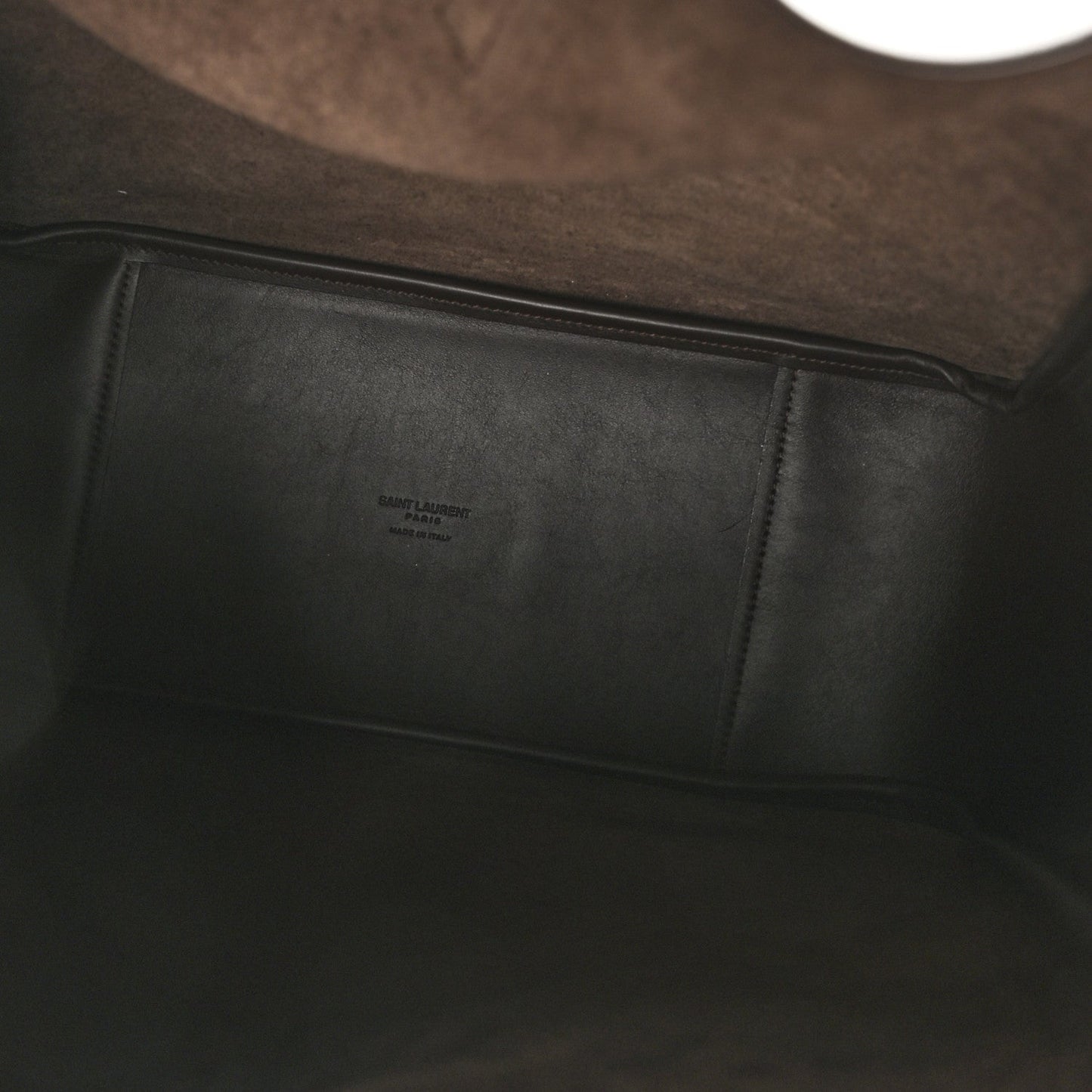 Leather hobo bag interior with stitched panel and small embossed label