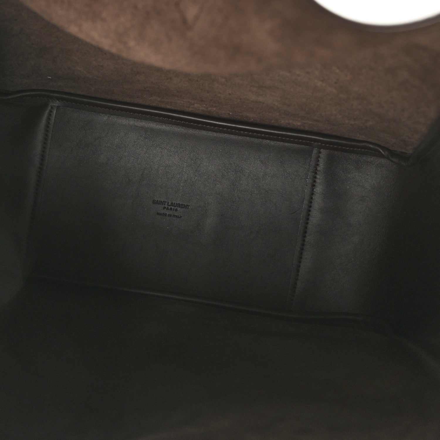 Leather hobo bag interior with stitched panel and small embossed label