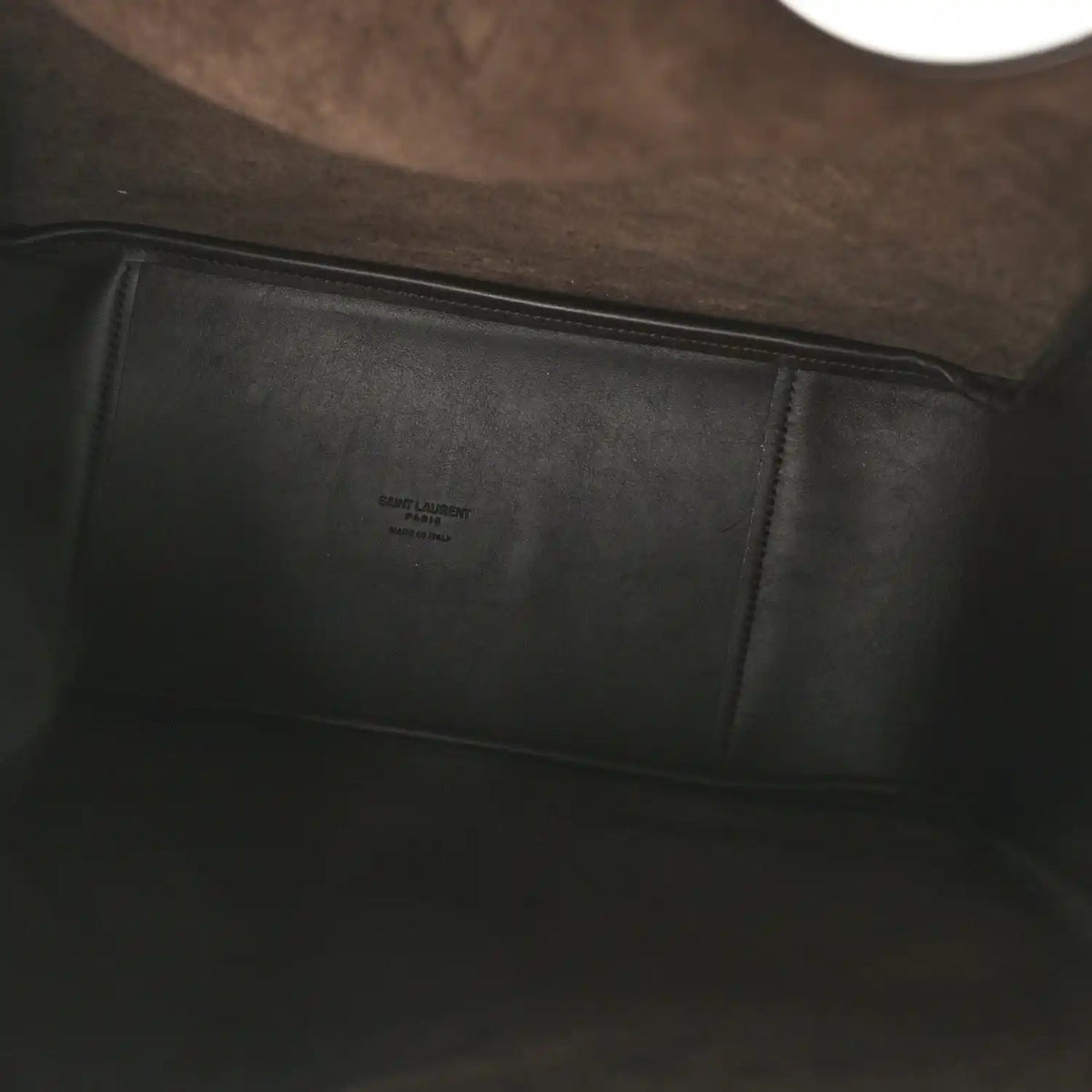 Leather hobo bag interior with stitched panel and small embossed label