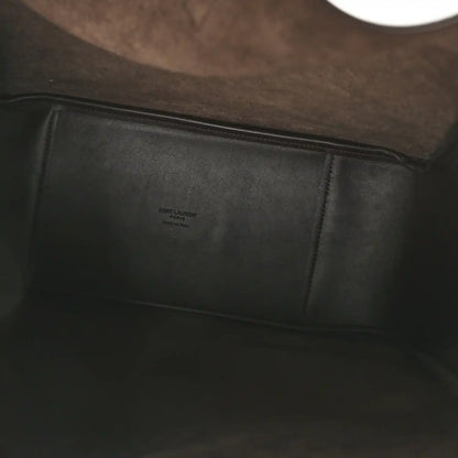 Leather hobo bag interior with stitched panel and small embossed label
