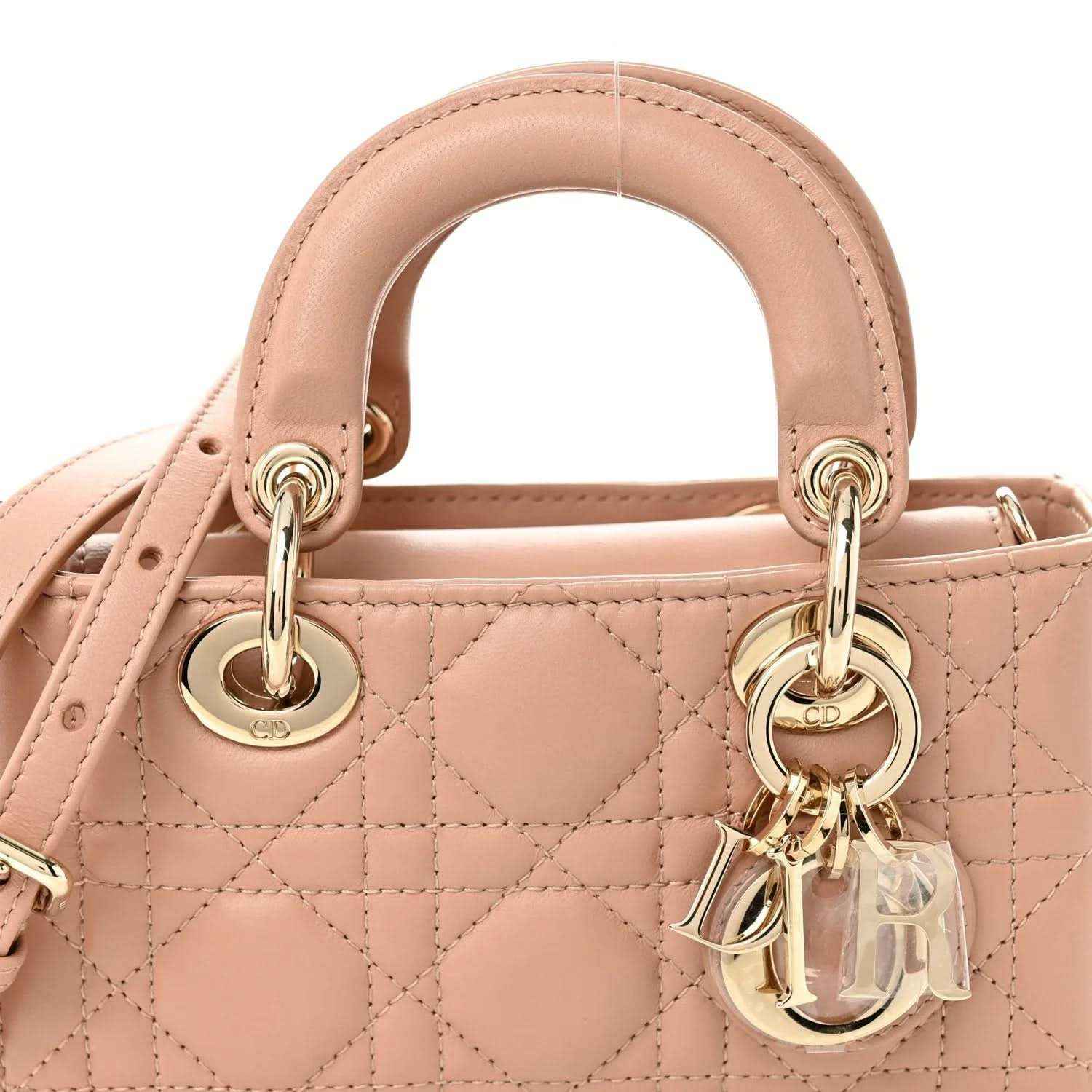 Pink beige micro handbag front with quilted cannage pattern, top rings, and gold hardware