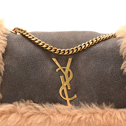 Saint Laurent reversible satchel with dark leather front, YSL monogram charm, gold chain