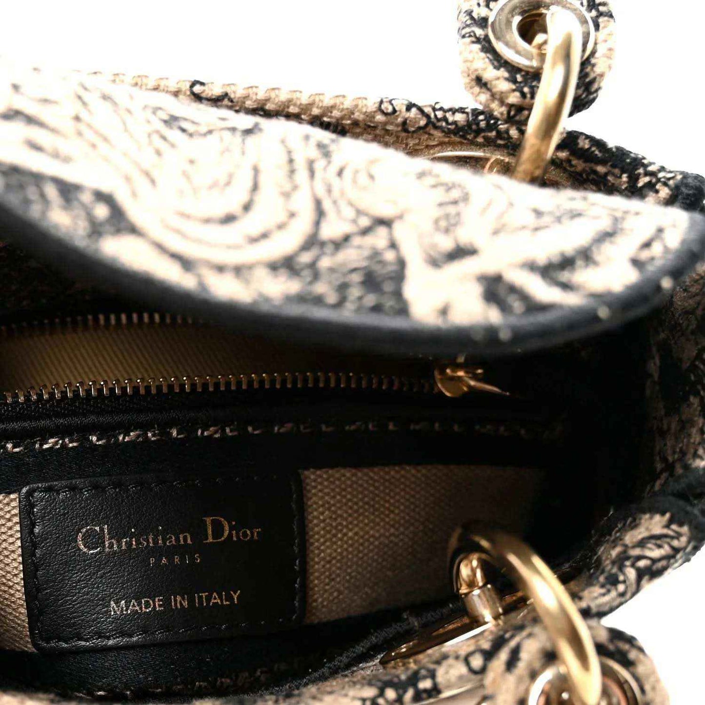 Leather logo patch reading Christian Dior, Made in Italy, on black interior