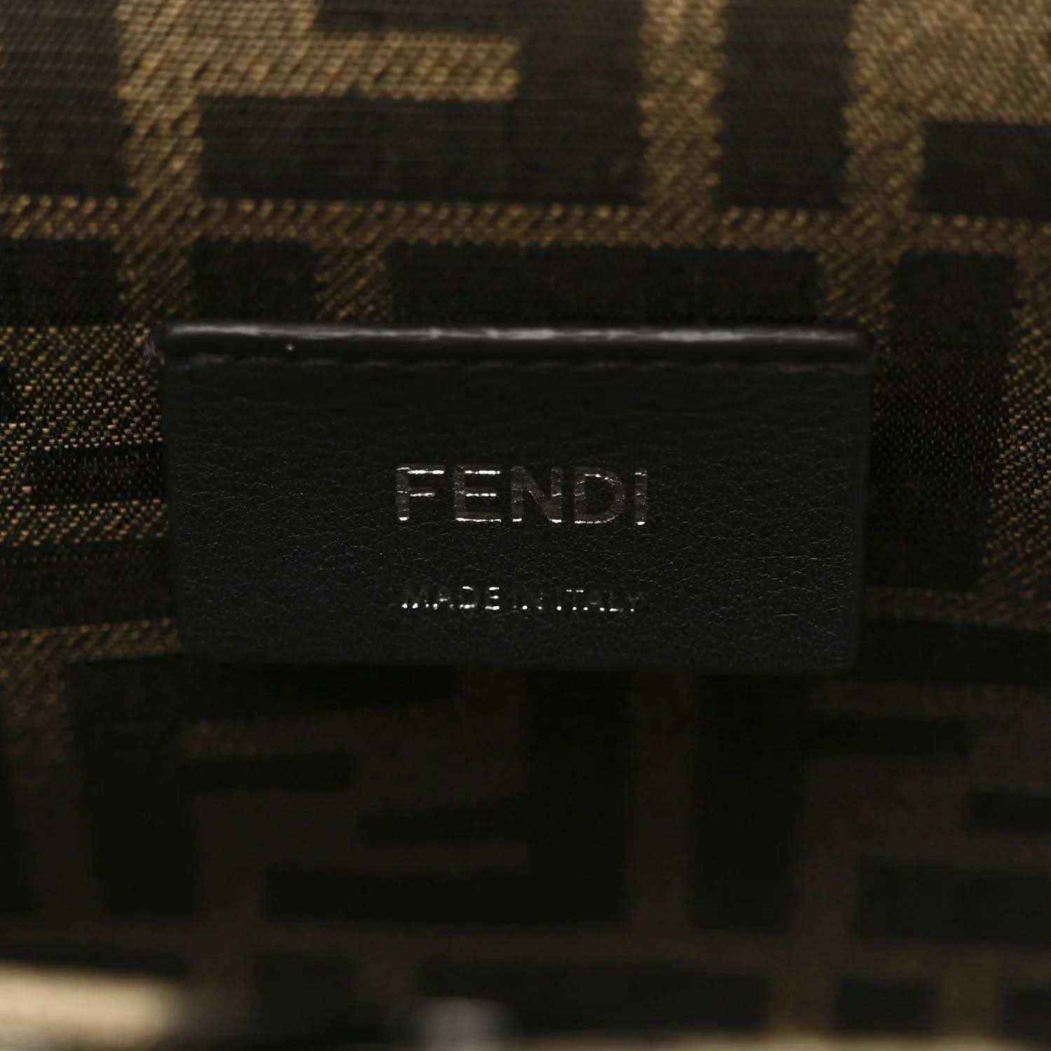 Leather clutch interior label showing “FENDI” and maker details