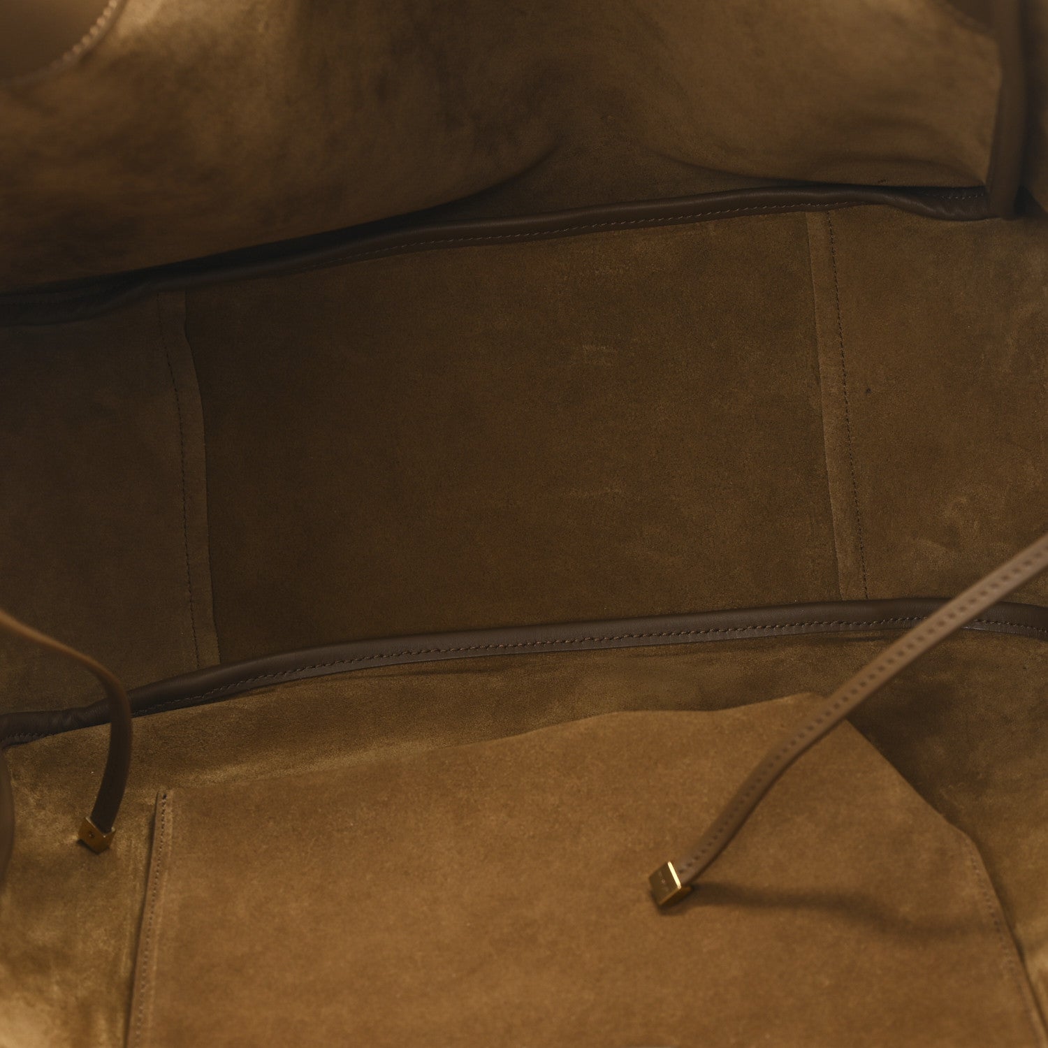 Suede tote bag interior with zip closure and tan suede lining