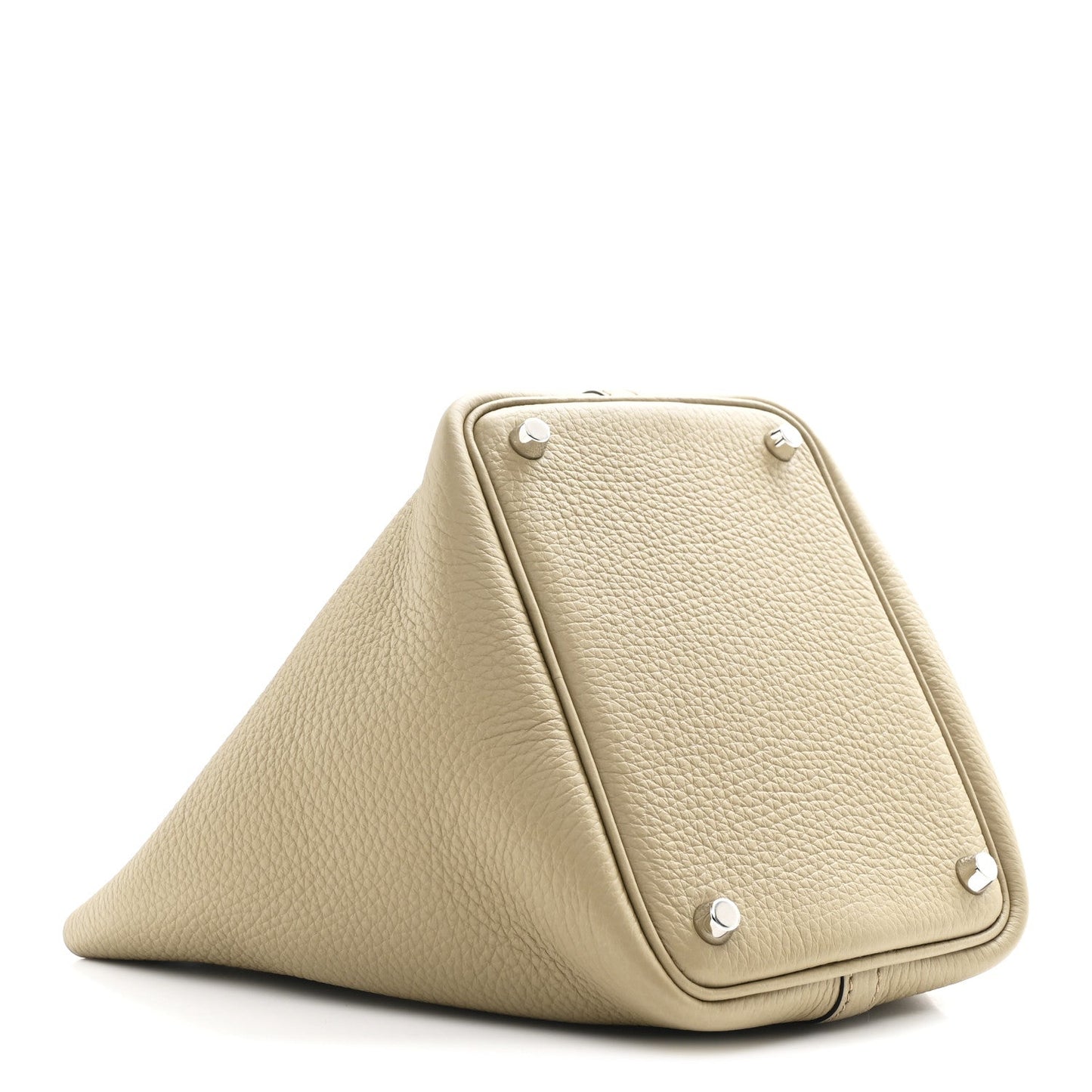 Beige leather handbag with triangular fold, corner snaps, and metal studs