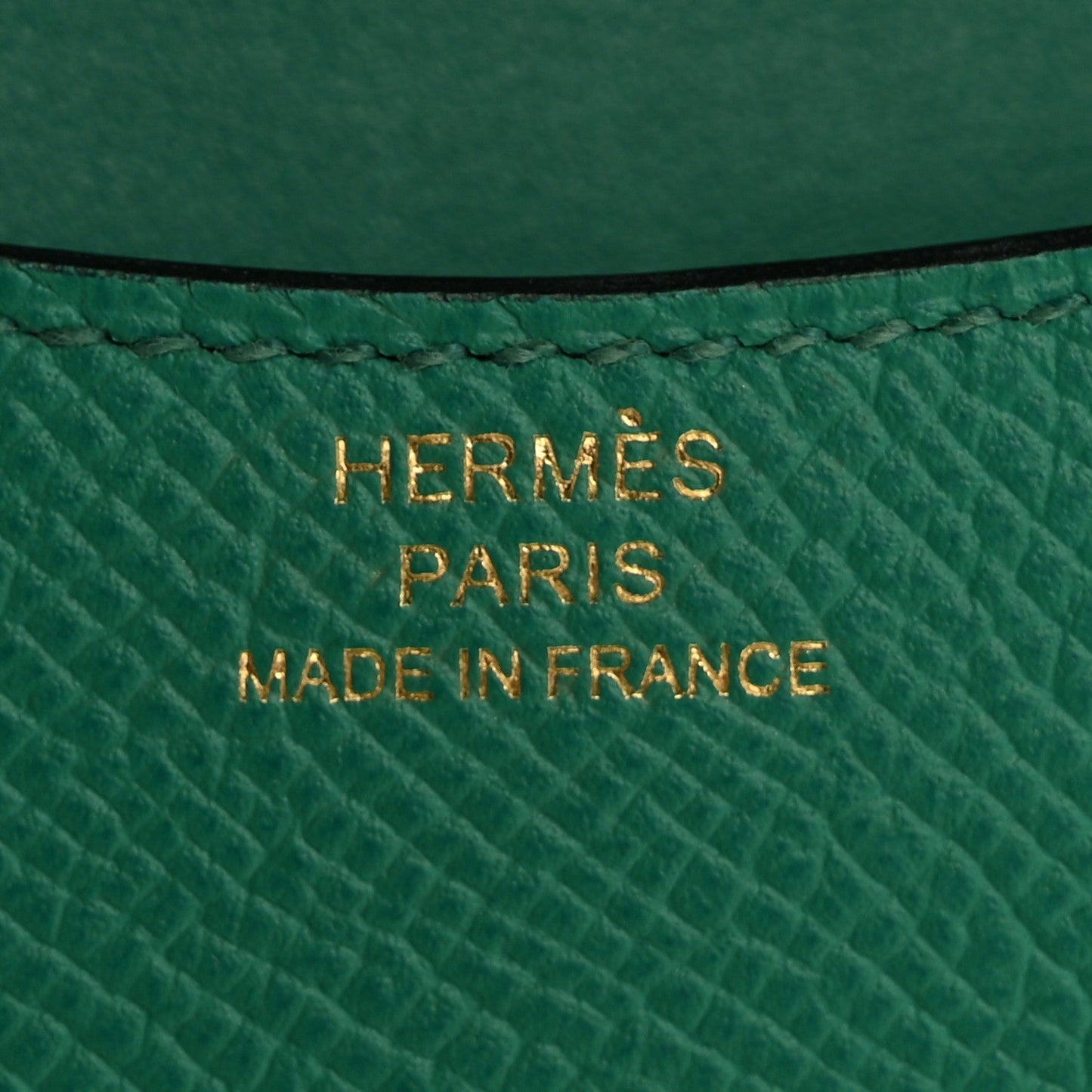 Green leather stamp reading HERMÈS PARIS MADE IN FRANCE
