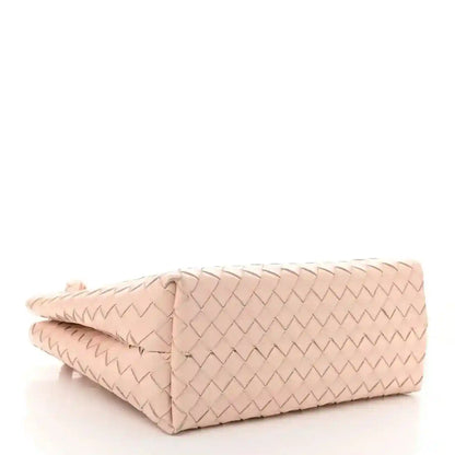Pink intrecciato leather medium tote bag, folded bottom corner view