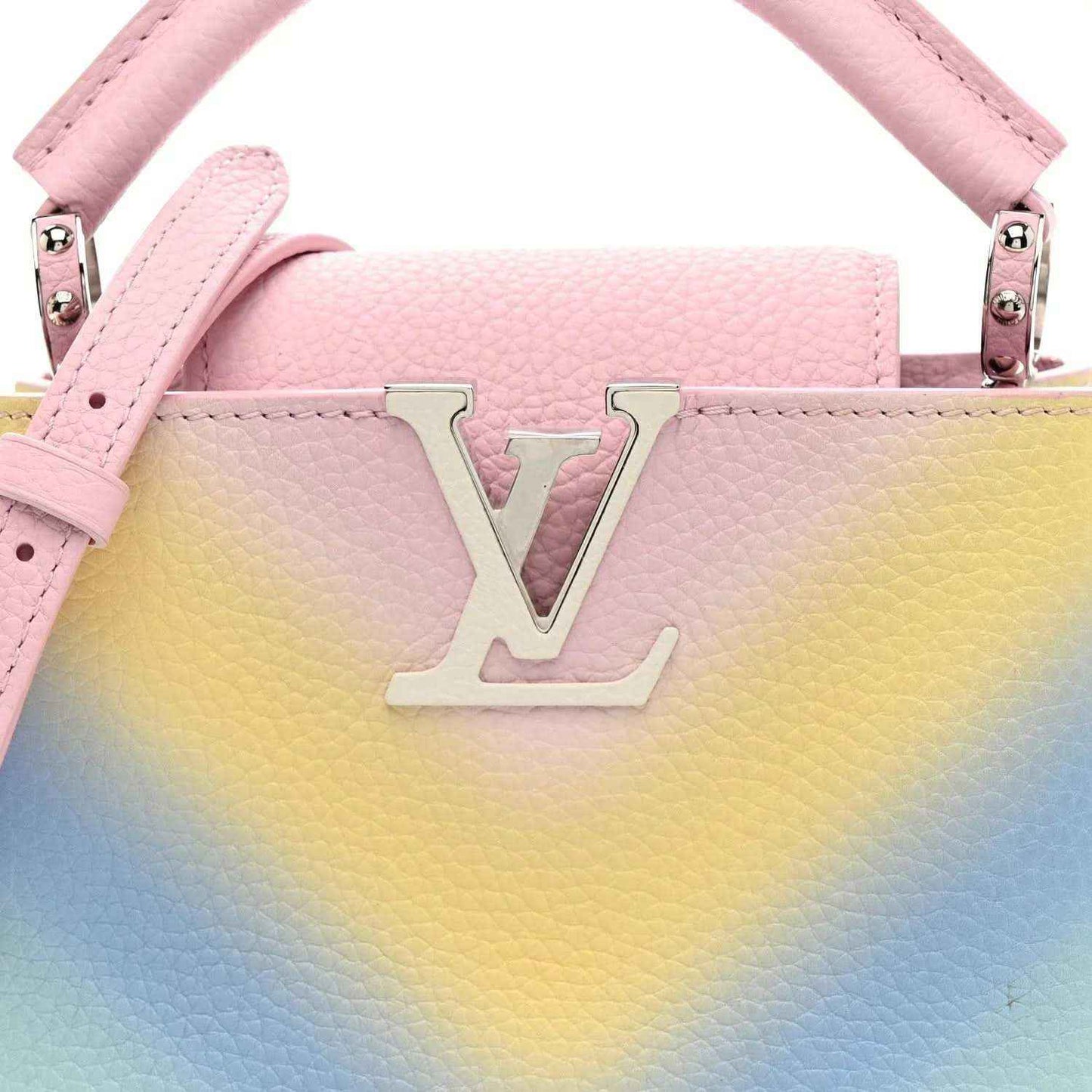 Mini Capucines bag front with LV emblem, rainbow gradient leather and pink top handle
