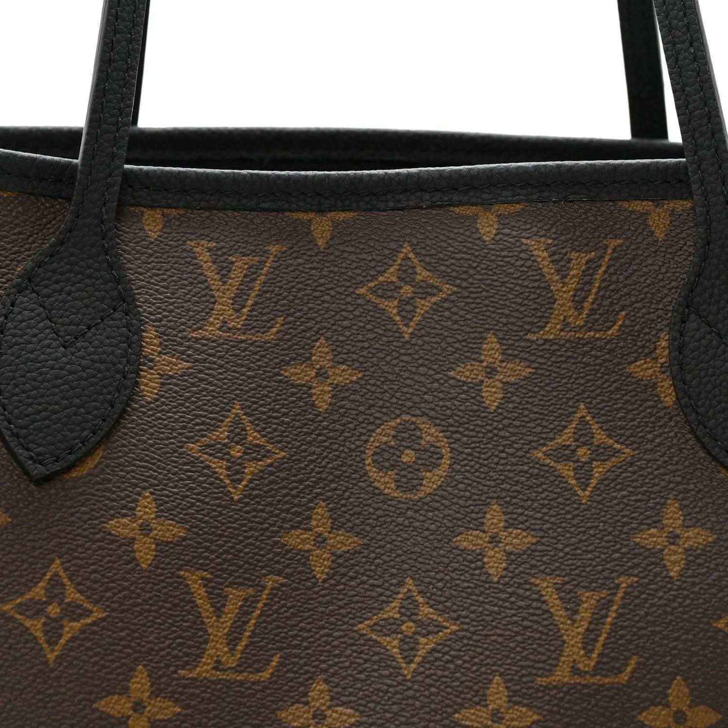 Monogram calfskin tote panel with black leather piping and textured leather