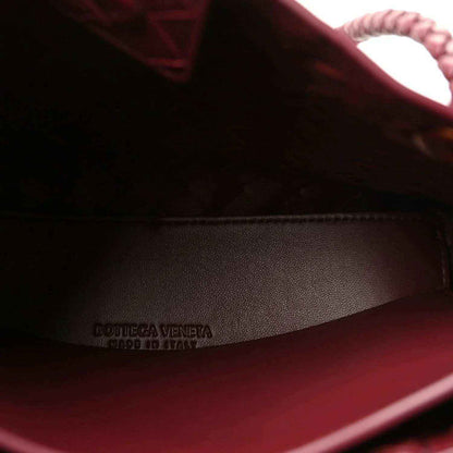 Bottega Veneta logo on burgundy leather lining inside the bag.