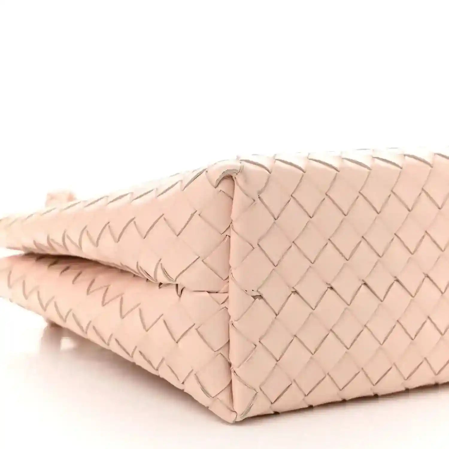 Pink intrecciato leather medium tote bag corner seam and braided texture close-up