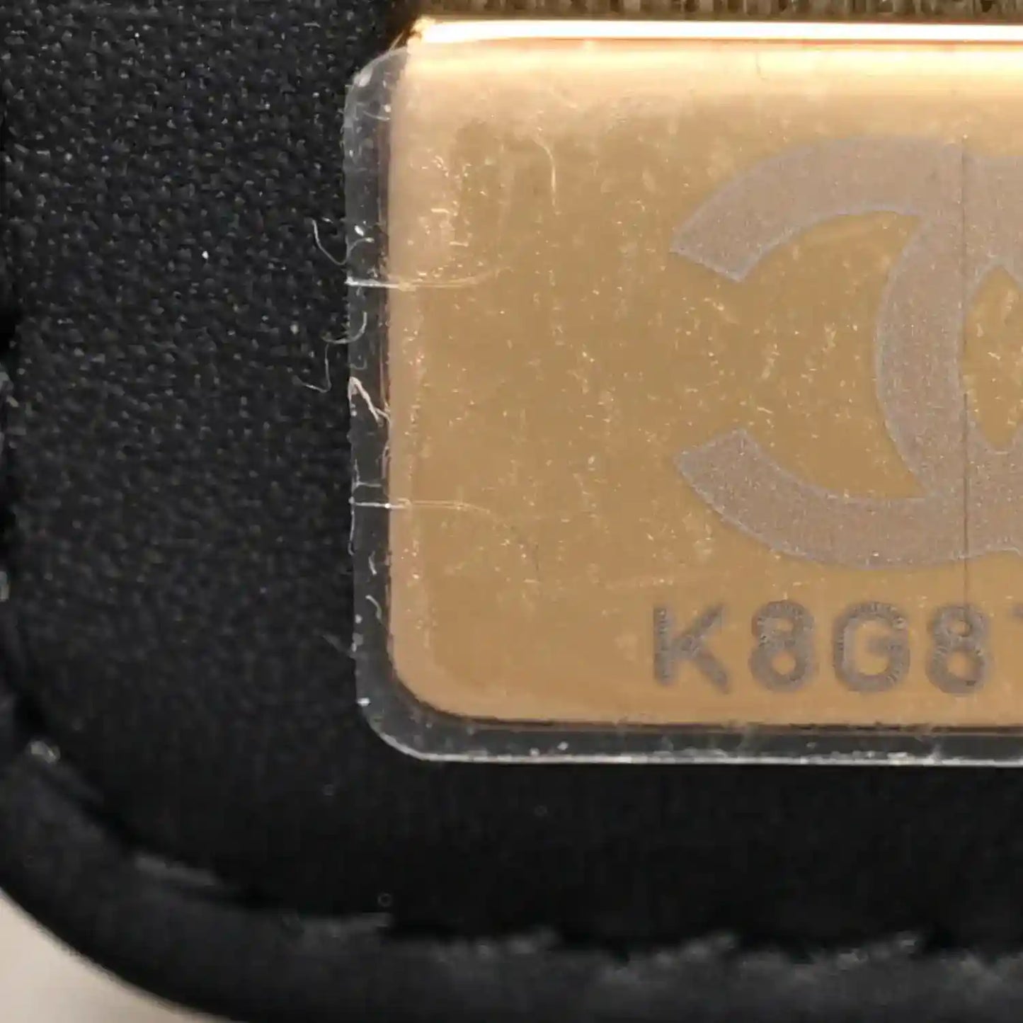 Black inner pocket label with gold K808 stamp