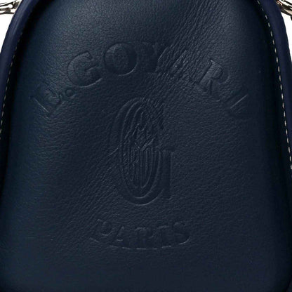 Close-up of navy leather Goyardine Bonbonniere bag with embossed Goyard logo