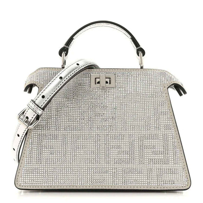 Crystal-embellished petite satchel bag with top handles and front square clasp, silver tone.