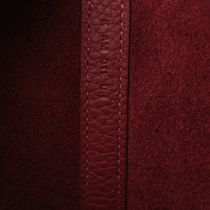 Burgundy grained leather seam with reinforced edge panel