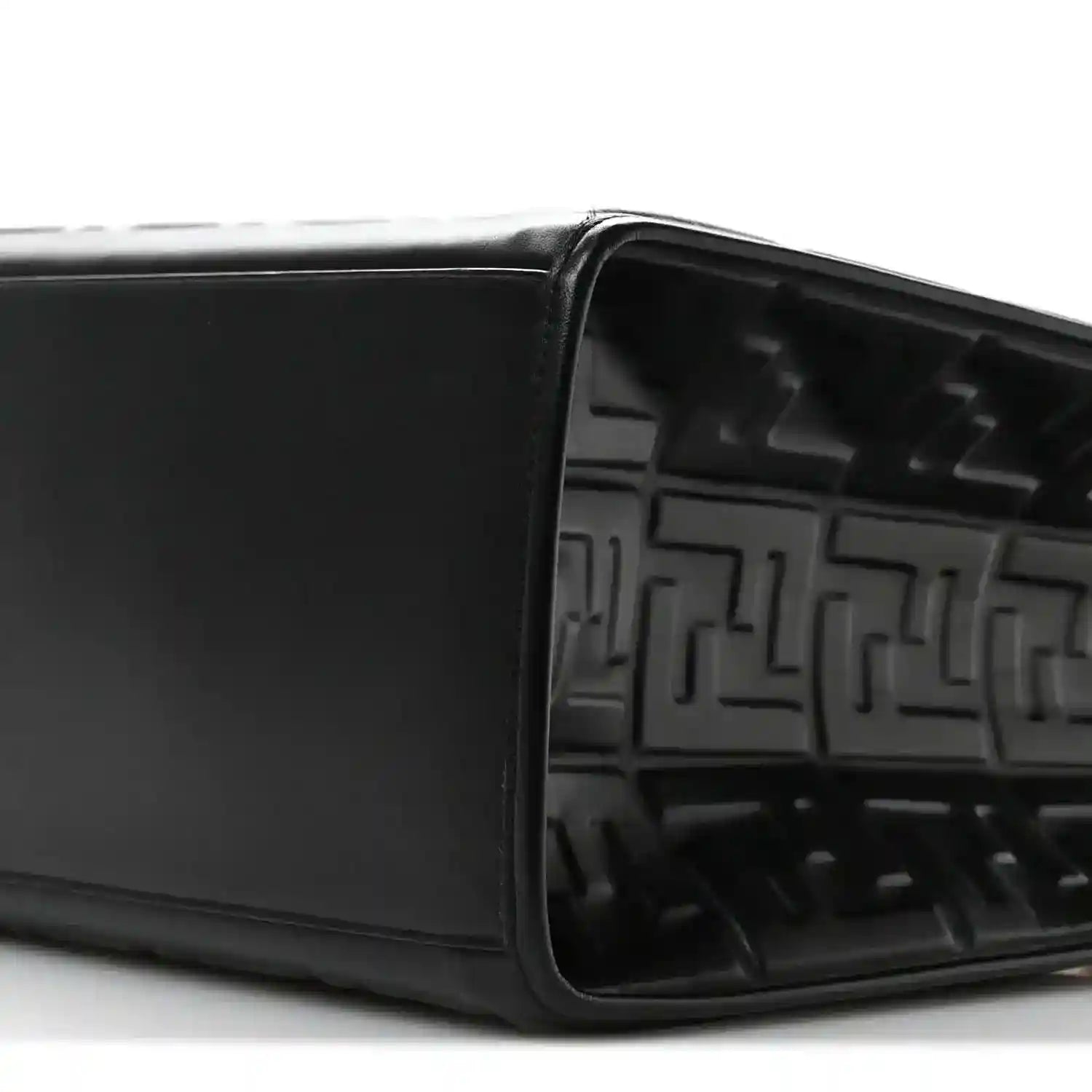 Black leather tote bag open top showing embossed FF pattern inside