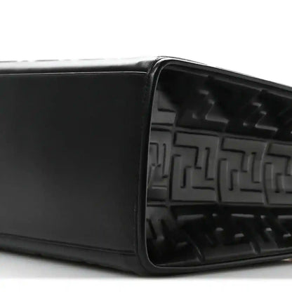 Black leather tote bag open top showing embossed FF pattern inside