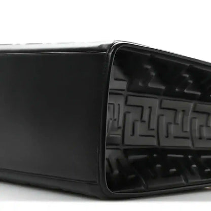 Black leather tote bag open top showing embossed FF pattern inside