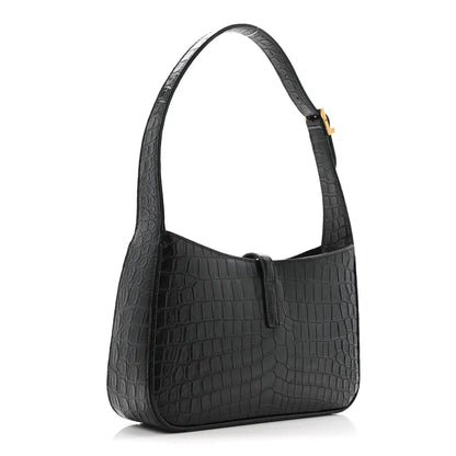 Black crocodile-embossed hobo bag with structured front and top handle.