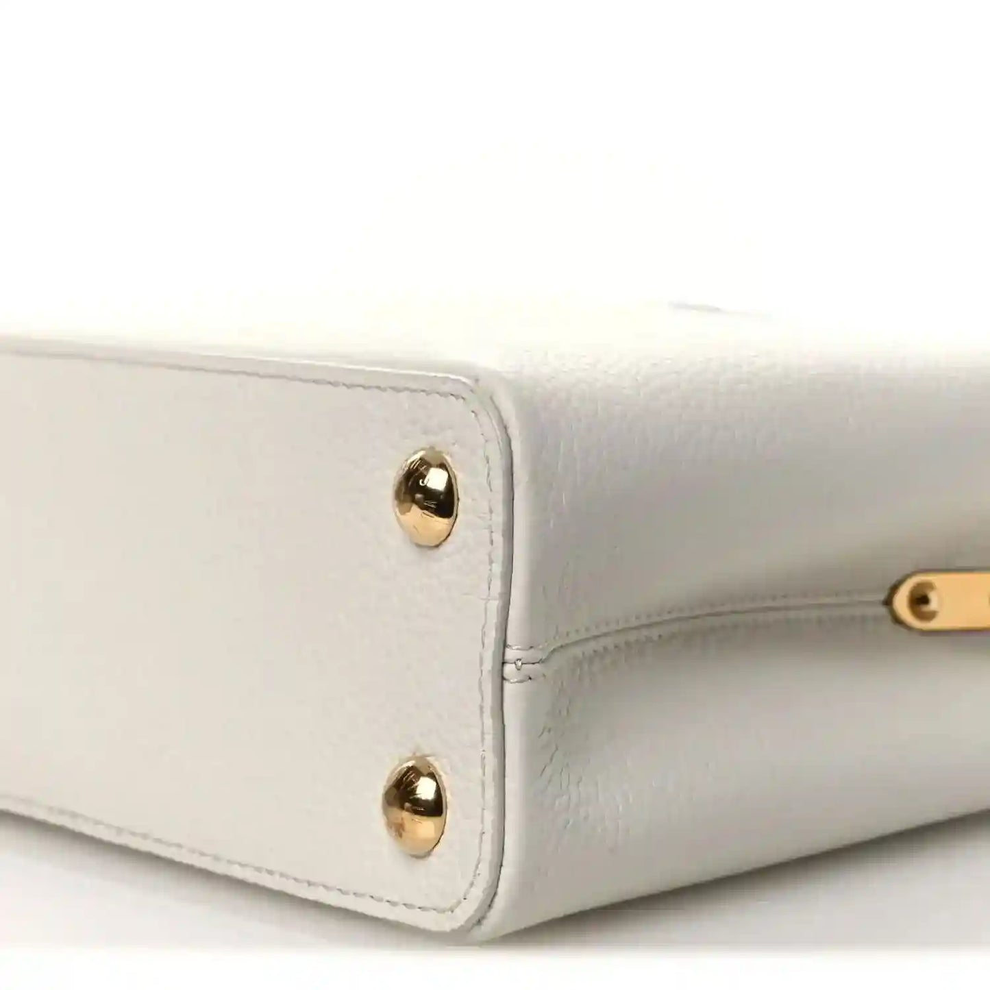 Louis Vuitton Capucines BB leather handbag corner with gold-tone studs and piping