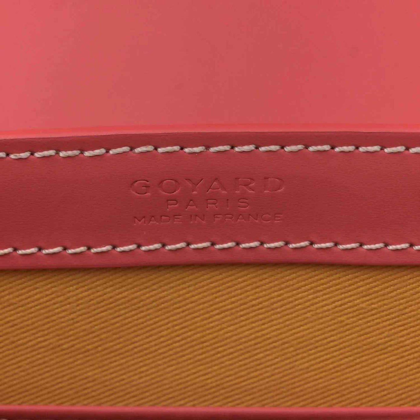 Pink canvas stamp text: GOYARD PARIS, MADE IN FRANCE, with contrast stitching.