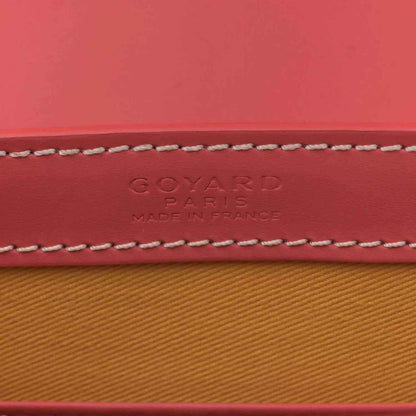 Pink canvas stamp text: GOYARD PARIS, MADE IN FRANCE, with contrast stitching.