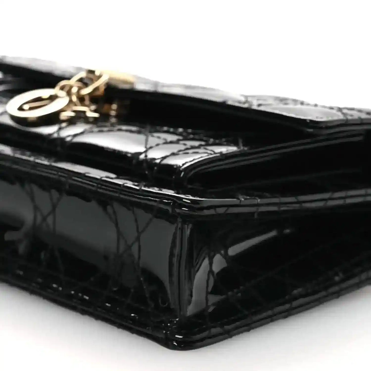 Black patent Cannage Lady Dior chain pouch, side profile with gold hardware