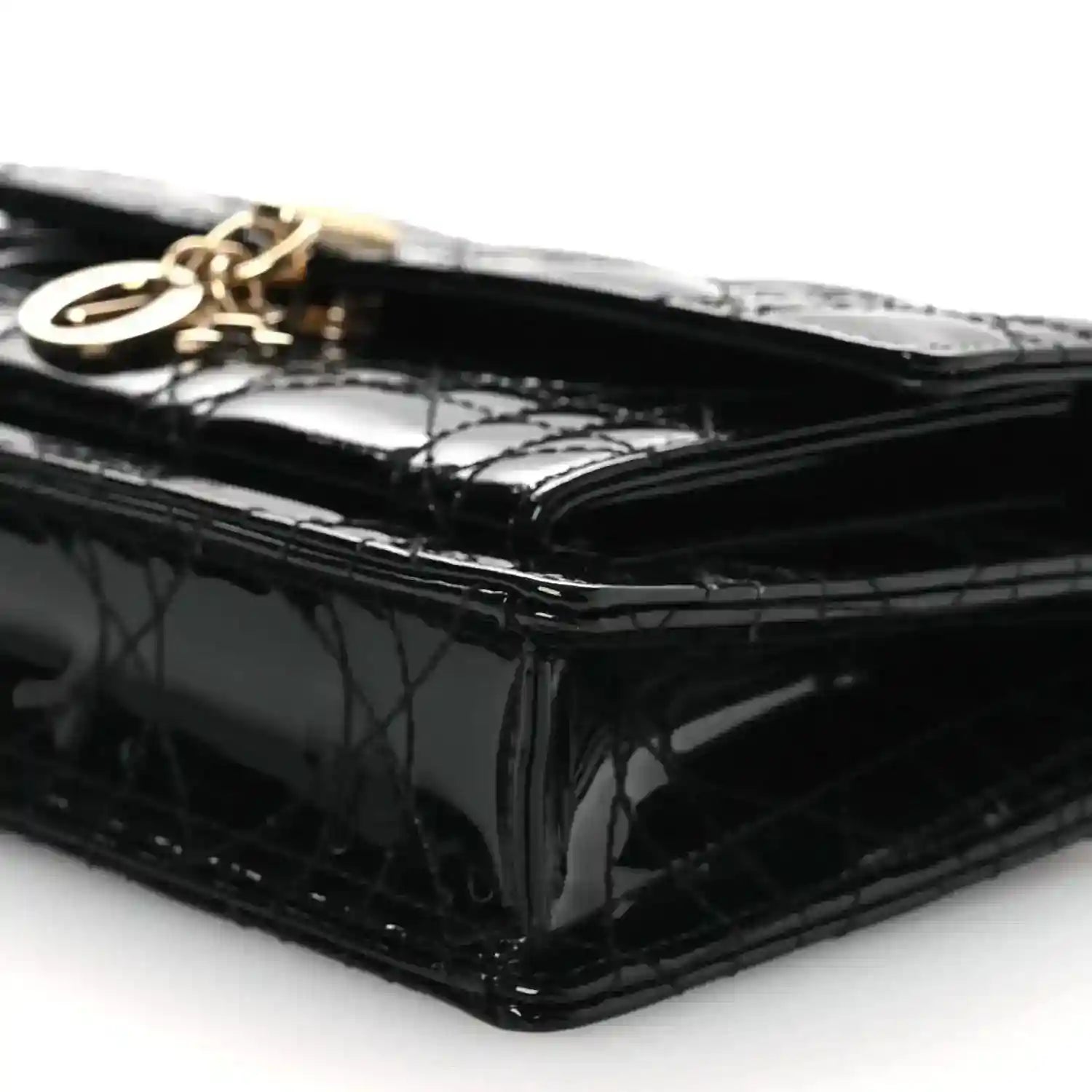 Black patent Cannage Lady Dior chain pouch, side profile with gold hardware