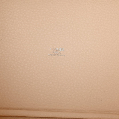 Nata leather handbag panel with embossed brand mark on textured grain
