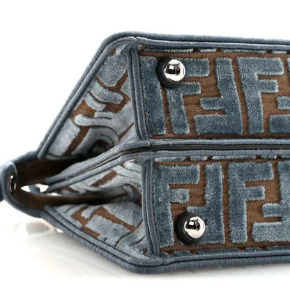 Satchel interior lining close-up with FF pattern and silver snap hardware
