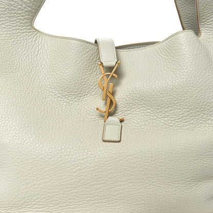 YSL charm key fob on white grained leather tote bag front