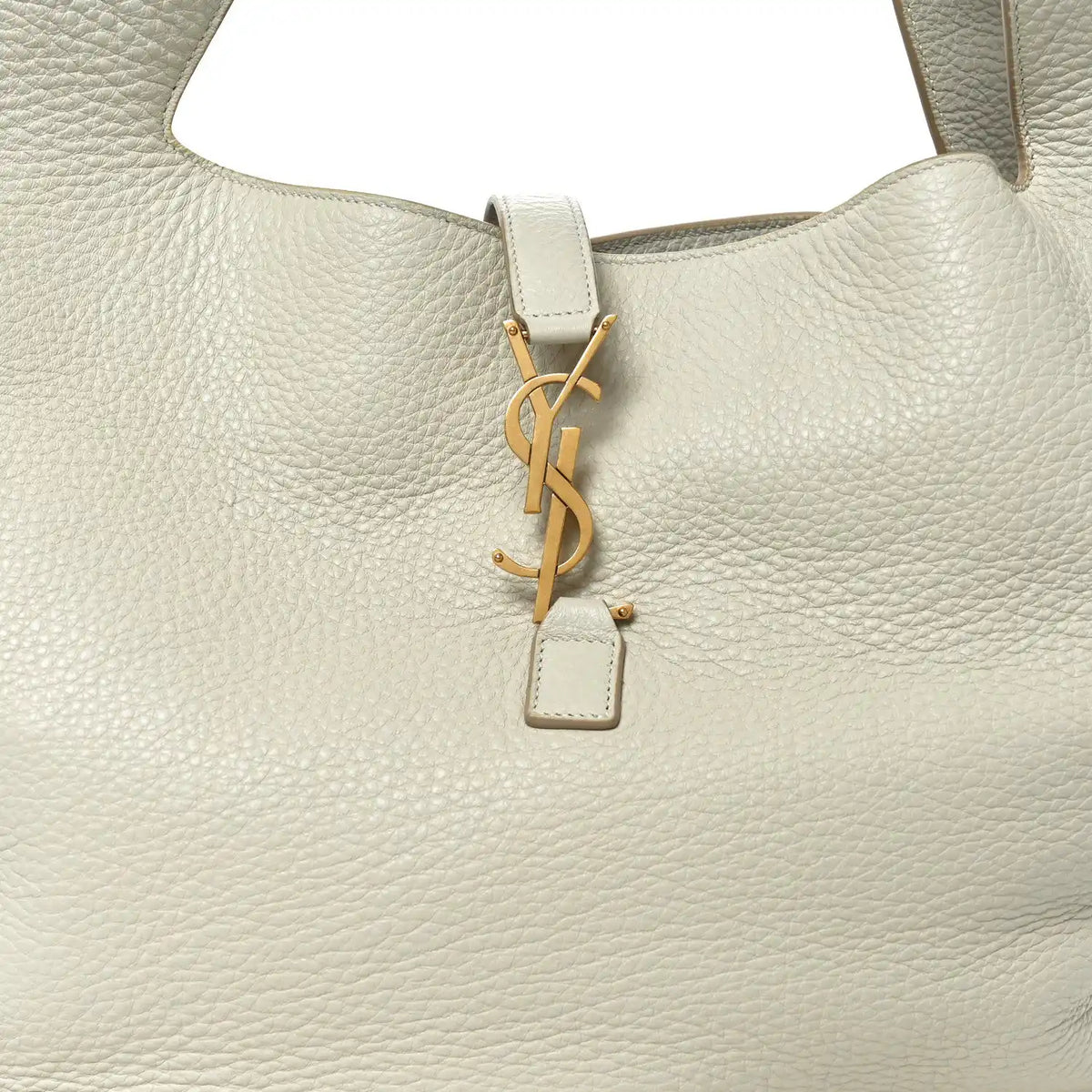 YSL charm key fob on white grained leather tote bag front