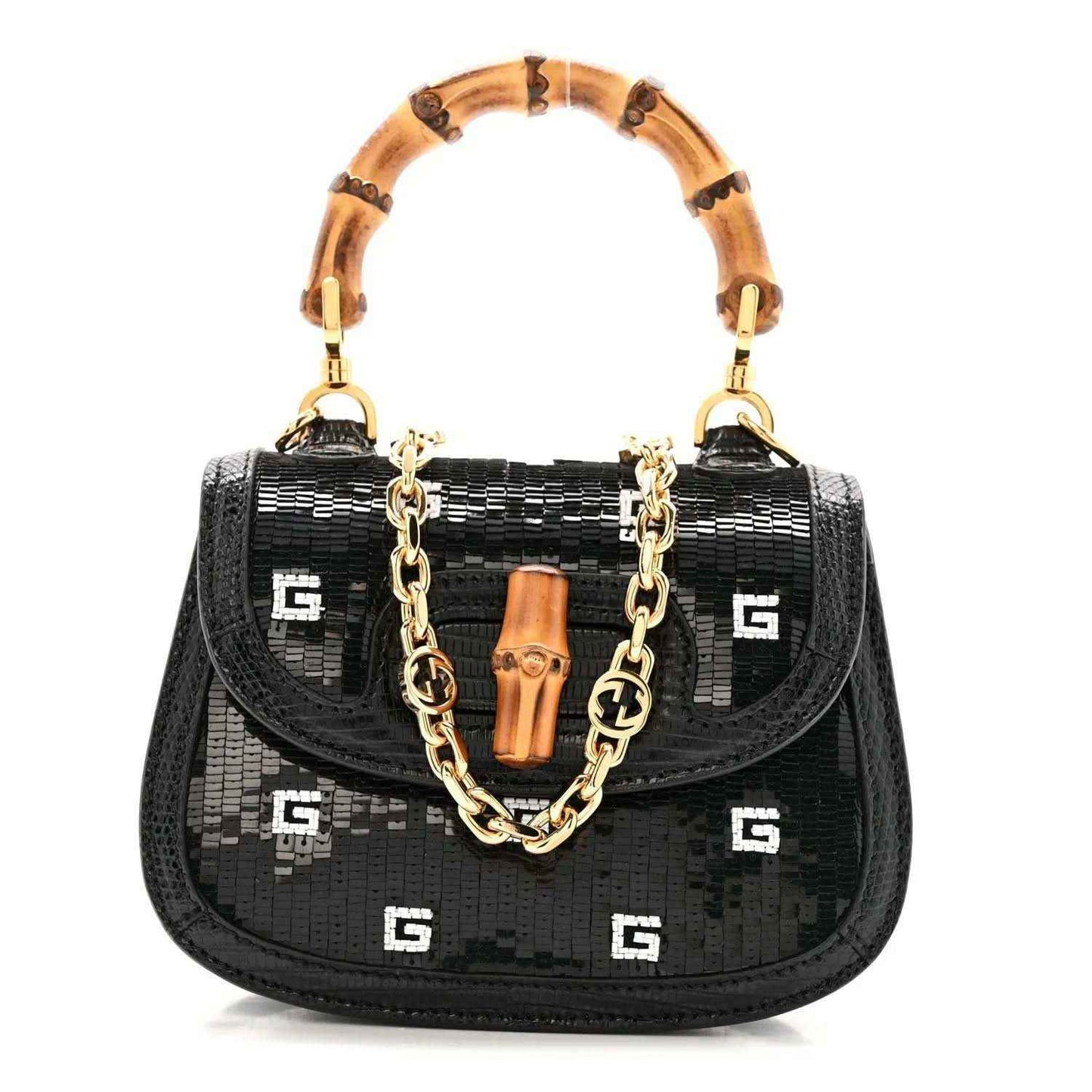 Black mini top handle bag with allover GG pattern, gold chain strap, and bamboo handles