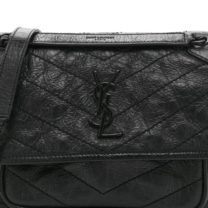 Black satchel front with YSL monogram on quilted crinkled leather flap