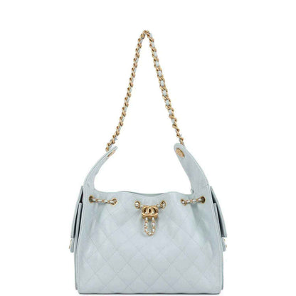 Light blue quilted caviar mini hobo bag on gold chain straps with front emblem