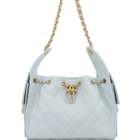 Light blue quilted caviar hobo bag with gold chain straps and front emblem charm