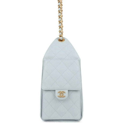 Light blue quilted caviar flap pocket with gold Chanel logo medallion
