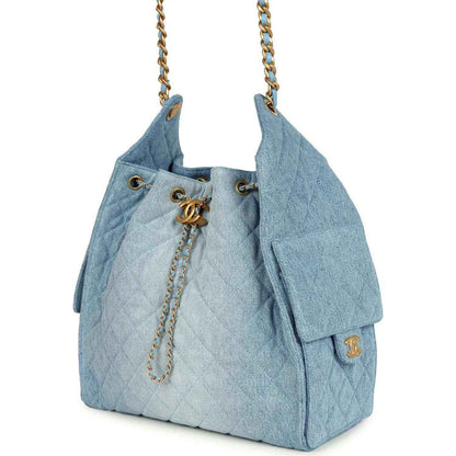 Chanel medium 25 hobo bag, blue washed denim, gold hardware, side tassel detail