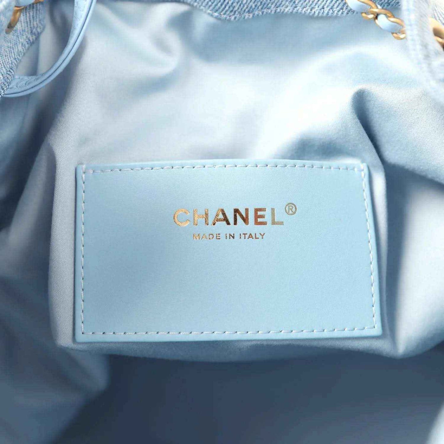 Chanel medium 25 hobo bag label, gold CHANEL® and Made in Italy text