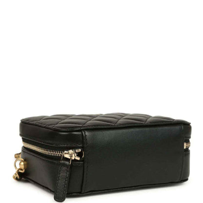 Black leather clutch with gold-tone zipper and quilted top edge, flat base