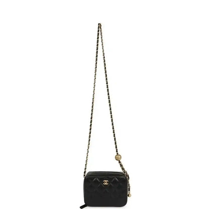 Black quilted lambskin mini clutch with long gold-tone chain strap and CC logo