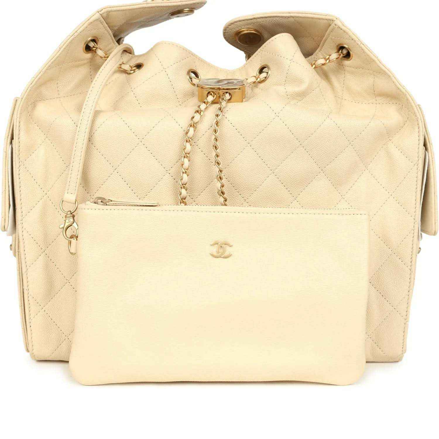 Light beige quilted caviar hobo bag with gold drawstring and Chanel clasp