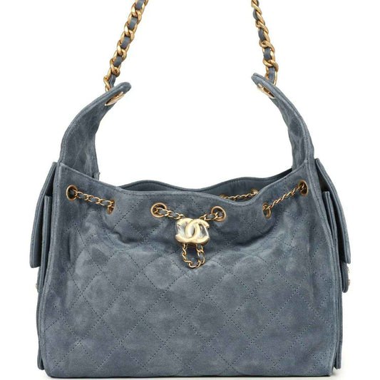 Small Chanel hobo bag in blue suede with diamond-quilt pattern and gold chain handles