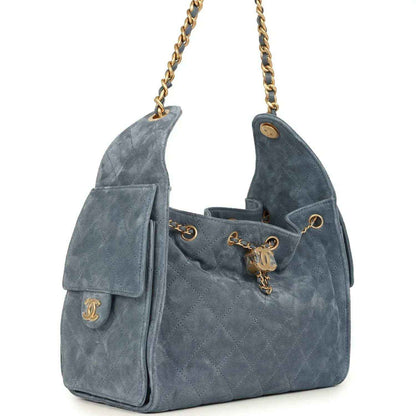 Small Chanel hobo bag in blue suede with quilted texture, side flap pocket, gold chain