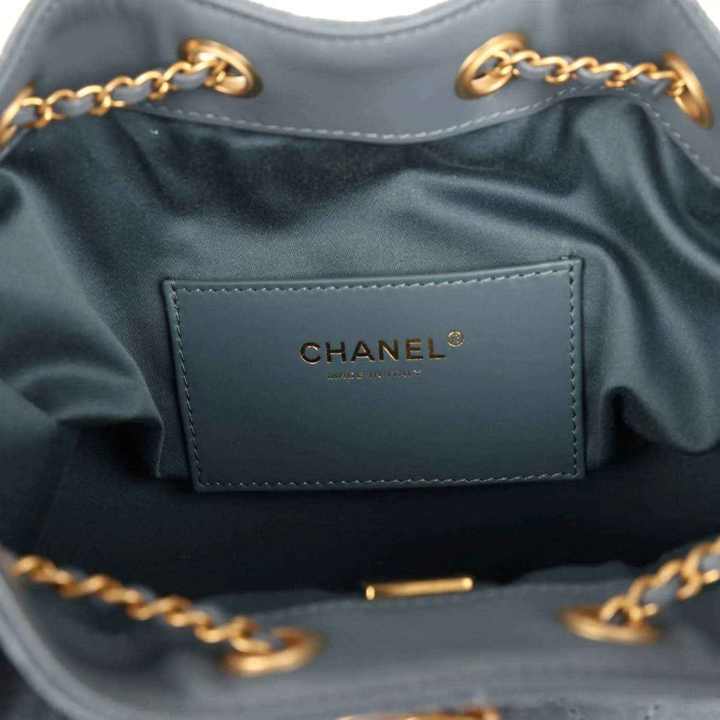 Chanel hobo bag interior label with CHANEL logo on blue fabric lining